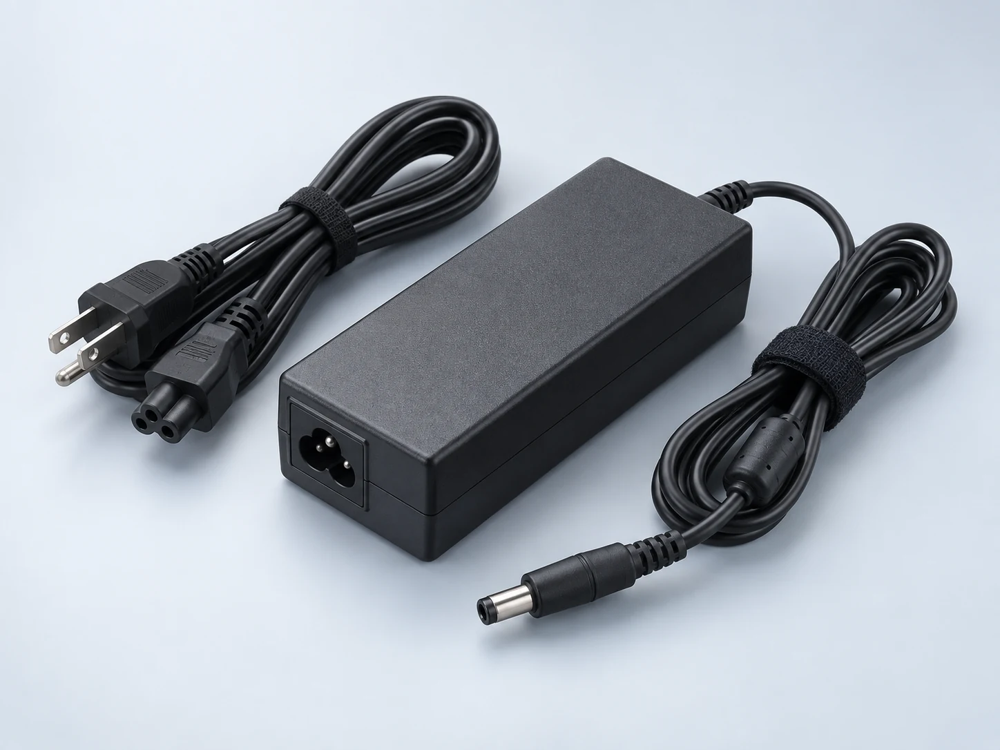 Illustration of a laptop charger and power adapter